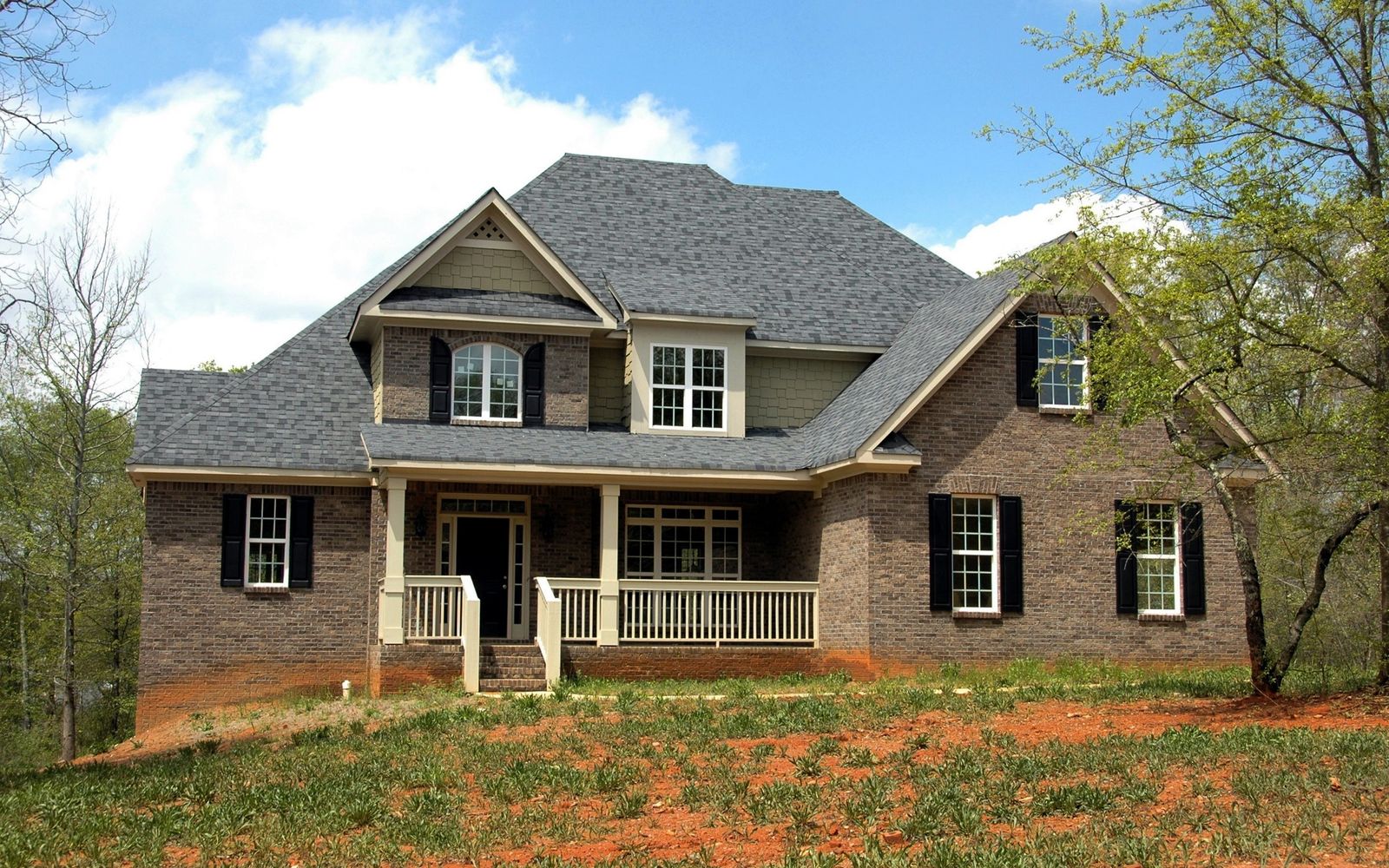 Two-story home with a new shingle roof